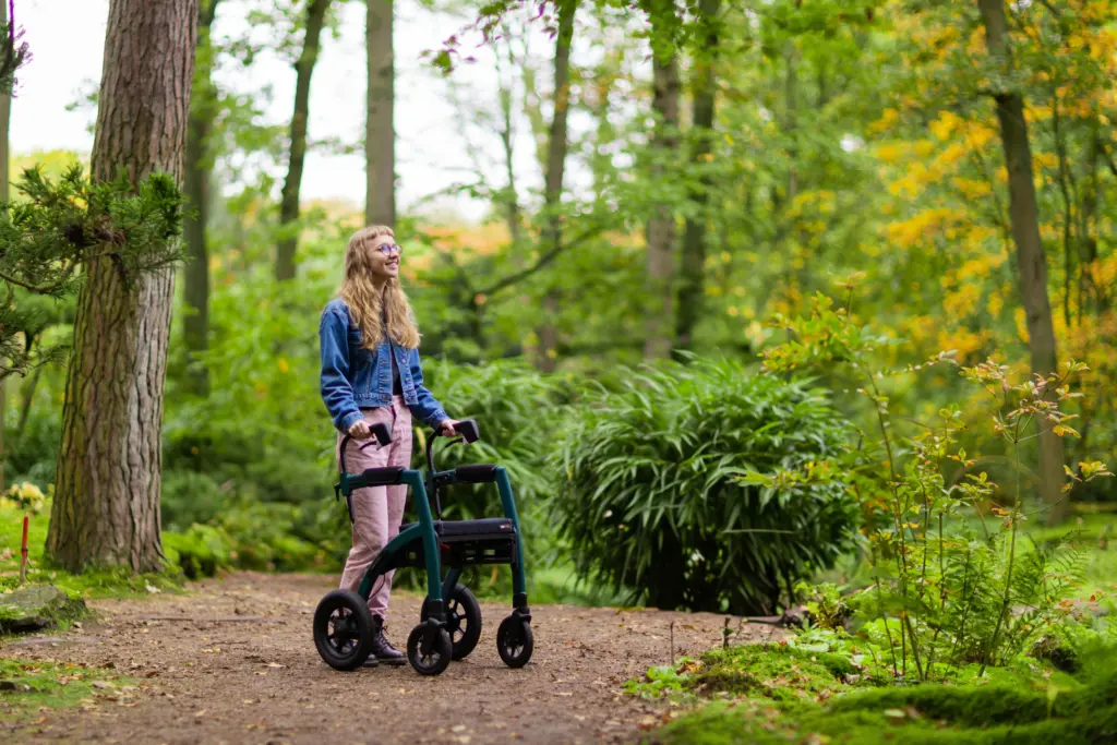 a woman who may be eligible for a disability allowance, pushing an assisted walking device