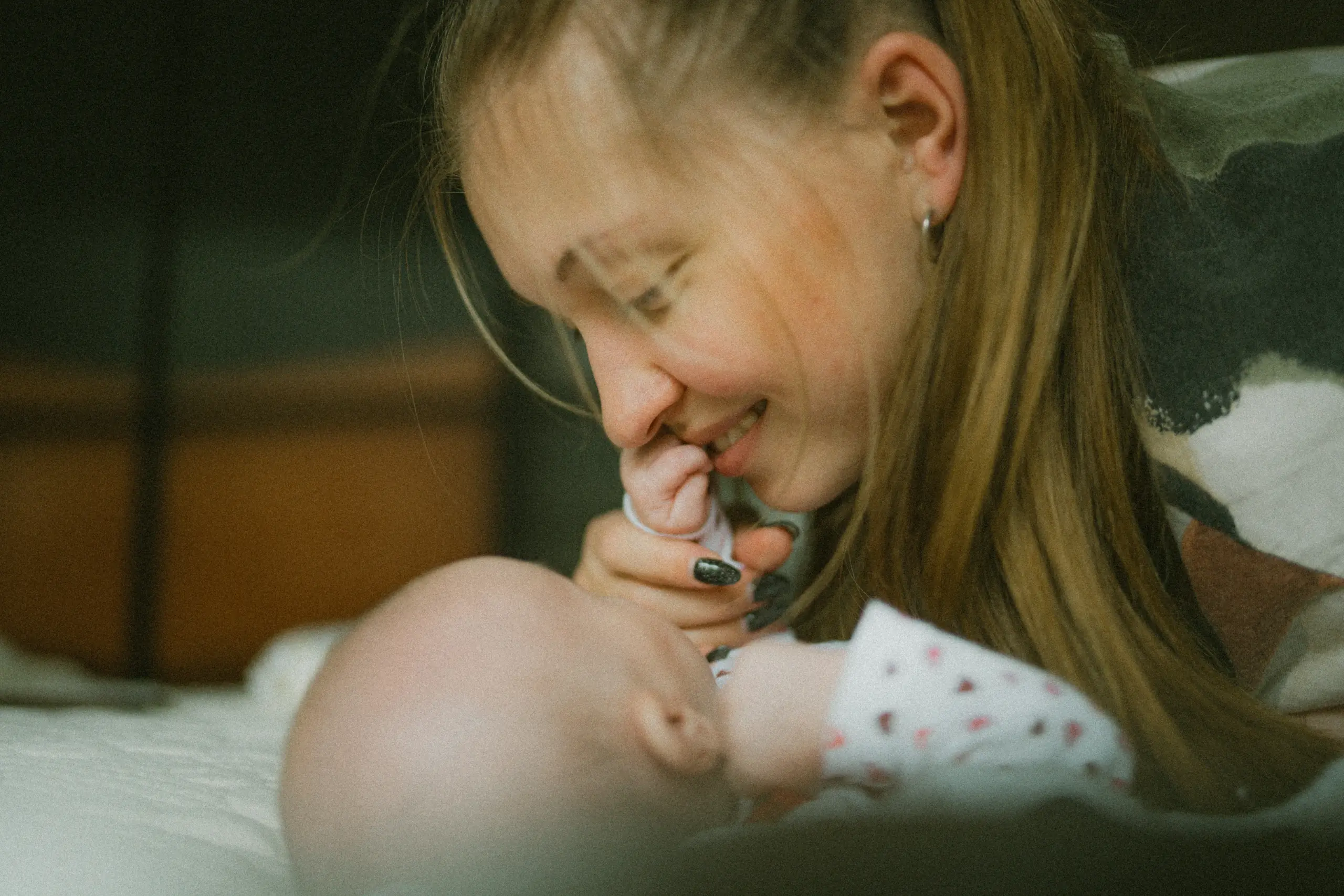 a woman playing with her baby. The woman could be eligible for the incapacitated child tax credit